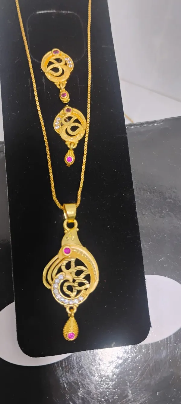 Traditional_Gold_Toned_Om_Pendant_Necklace_And_Earrings_Set_With_Purple_Stone_Accents