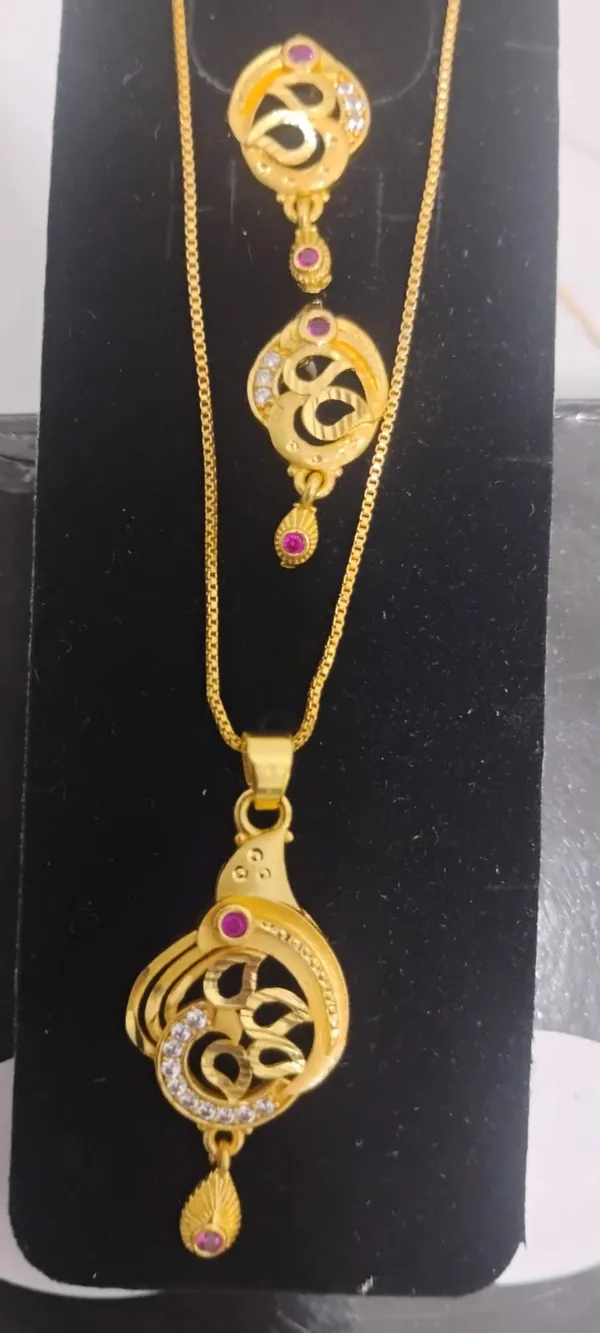 Traditional_Gold_Toned_Om_Pendant_Necklace_And_Earrings_Set_With_Purple_Stone_Accents