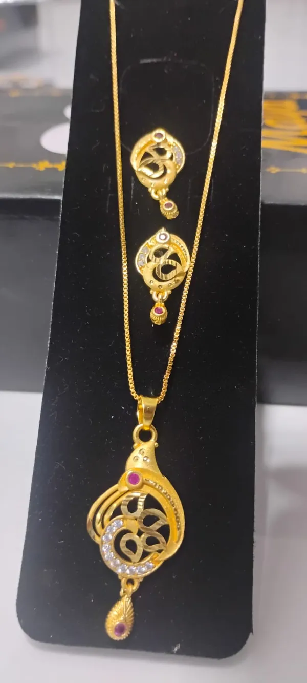 Traditional_Gold_Toned_Om_Pendant_Necklace_And_Earrings_Set_With_Purple_Stone_Accents