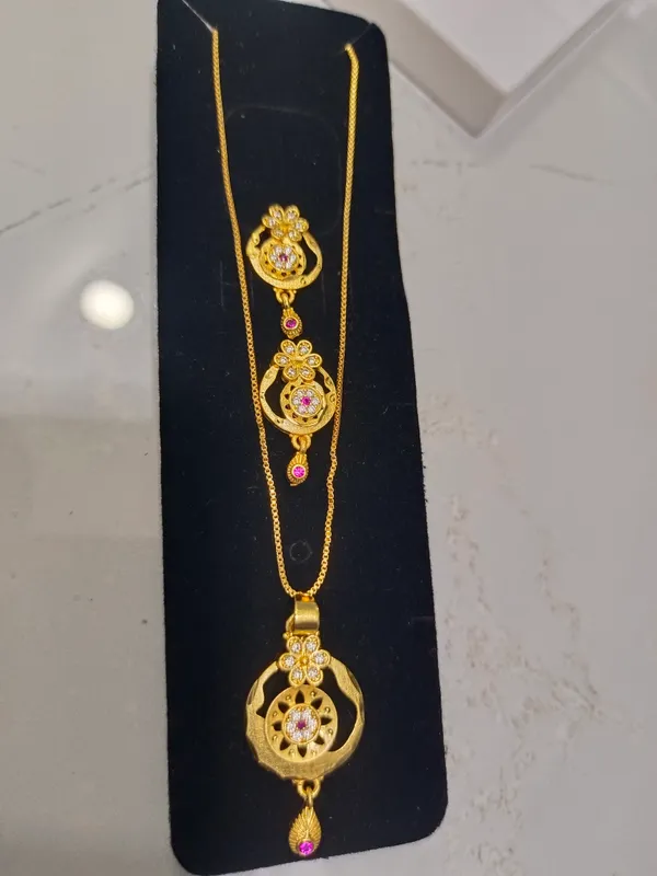 Traditional_Gold_Plated_Floral_Pendant_Necklace_Set_With_Pink_Stone_Accents