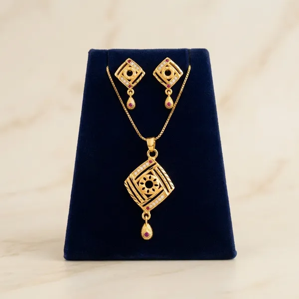 Gold_Toned_Kundan_Pendant_Necklace_Set_With_Pink_Stone_Accents