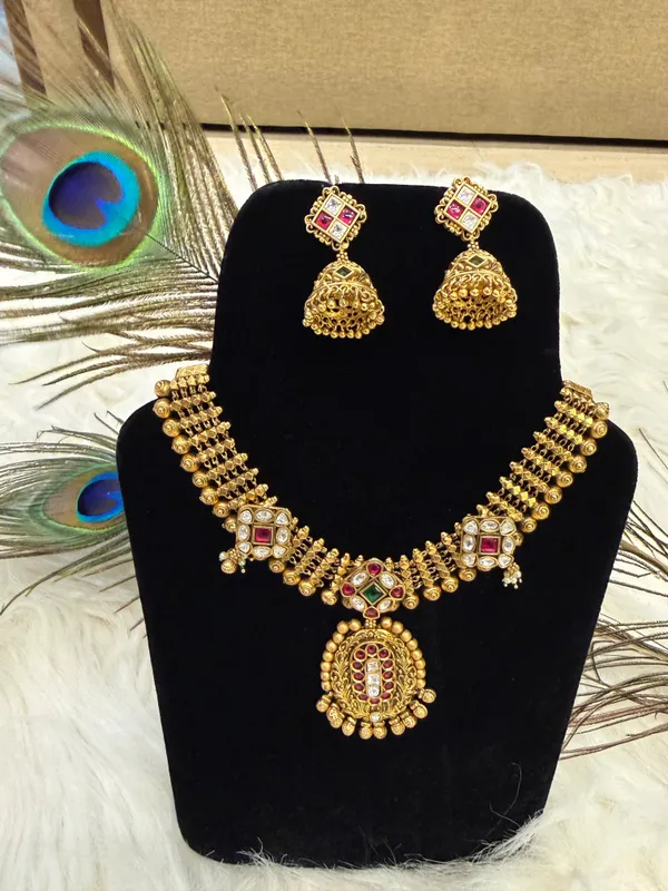 Antique_Gold-Toned_Copper_Alloy_Temple_Necklace_Set_With_Jhumka_For_Women