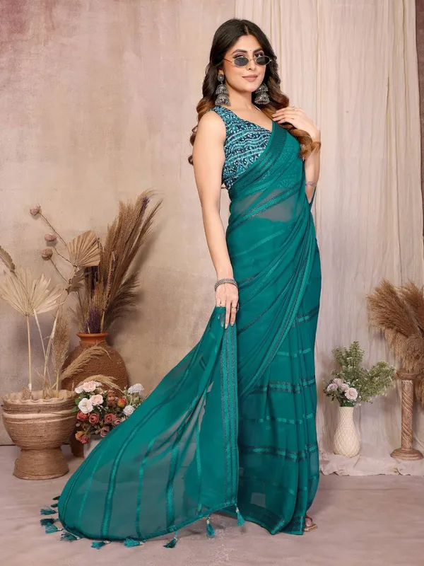 Elegant_Teal_Organza_Saree_With_Embellished_Blouse