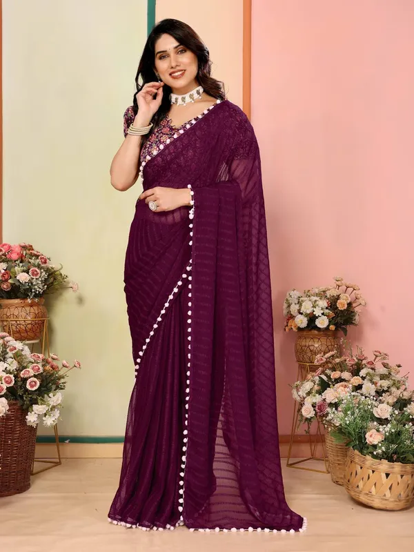 Purple_Georgette_Saree_With_Floral_Embroidered_Blouse_And_Pom-Pom_Border