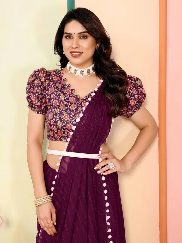 Purple_Georgette_Saree_With_Floral_Embroidered_Blouse_And_Pom-Pom_Border
