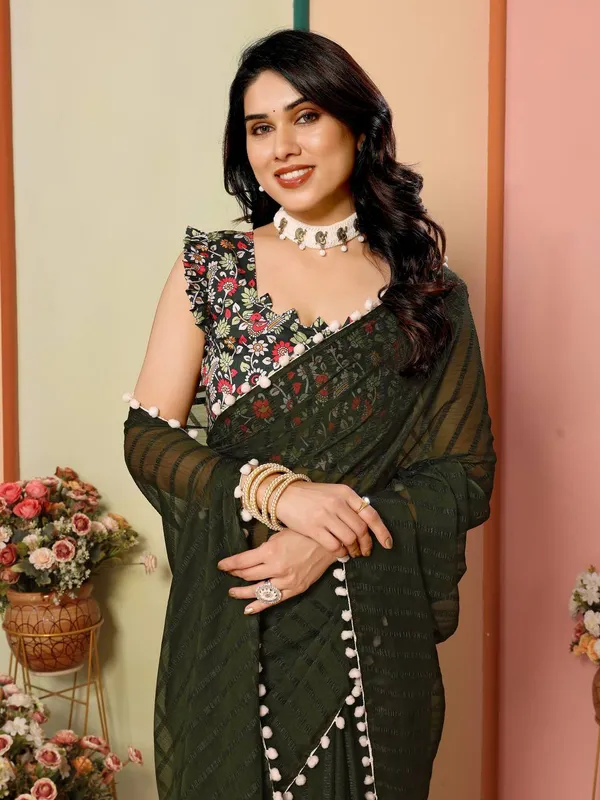 Elegant_Dark_Green_Saree_With_Floral_Embroidered_Blouse_And_Pom-Pom_Border