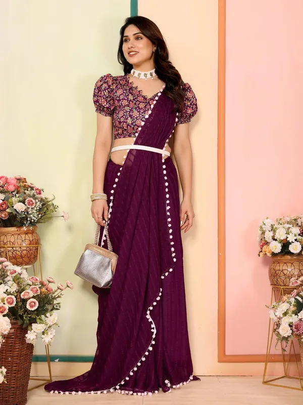 Purple_Georgette_Saree_With_Floral_Embroidered_Blouse_And_Pom-Pom_Border