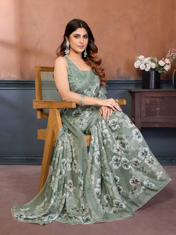 Elegant_Green_Floral_Print_Saree_With_Embroidered_Border