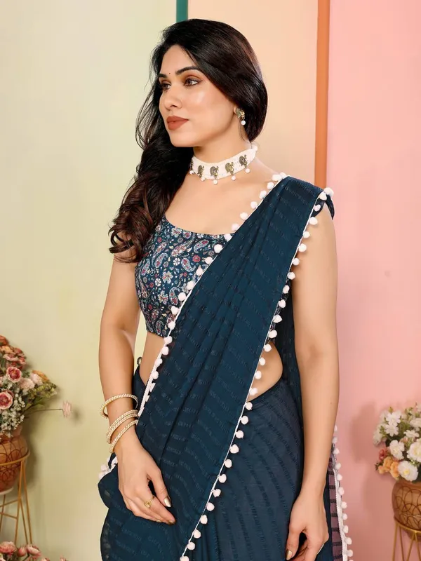 Dark_Teal_Saree_With_White_Pom-Pom_Border_And_Embroidered_Blouse