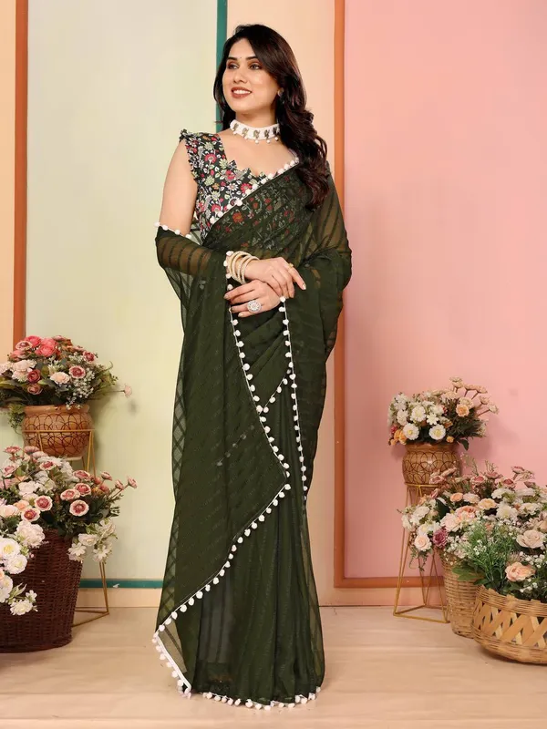 Elegant_Dark_Green_Saree_With_Floral_Embroidered_Blouse_And_Pom-Pom_Border