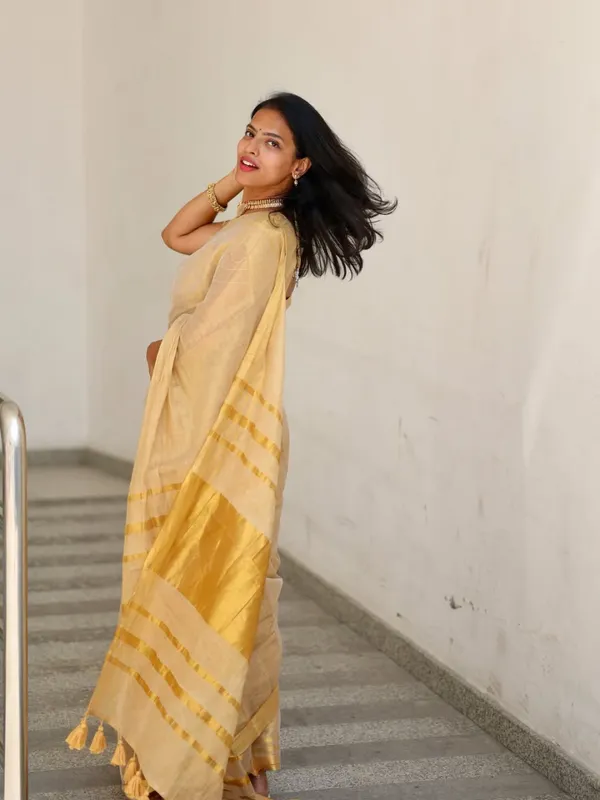 Off_White_Tissue_Silk_Kasavu_Zari_Border_Tassel_Pallu_Saree_For_Women