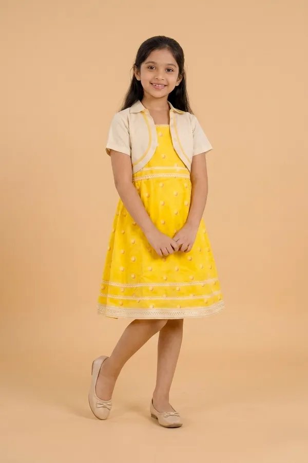 Yellow_And_Cream_Cotton_Lycra_Polka_Dot_Dress_With_Beige_Shrug_For_Girls