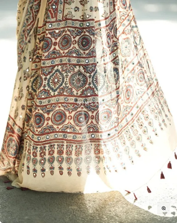 Ivory_Modal_Silk_Ajrakh_Printed_Saree_with_Floral_Motifs,_Heritage_Border_&_Tassel_Detailing_