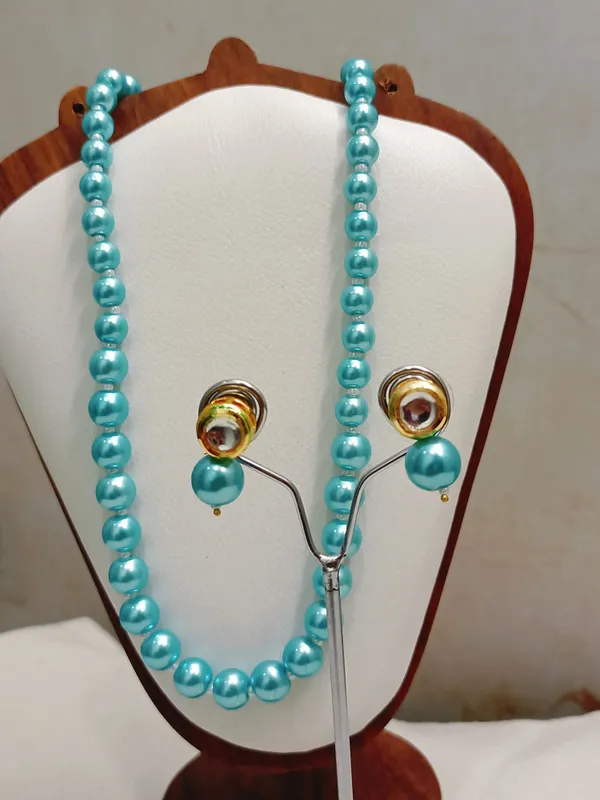Sky_Blue_Pearl_With_Golden_Earrings
