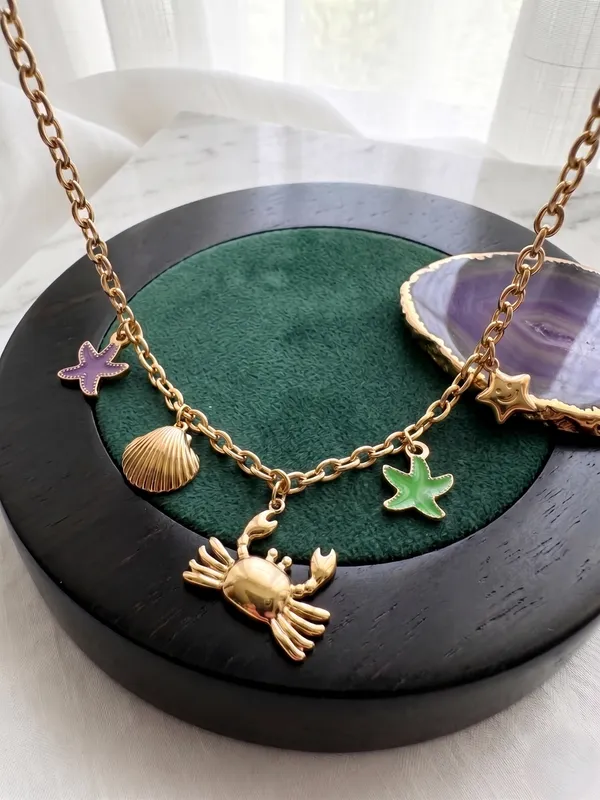 TGO_Ocean_Charm_Gold_Necklace_with_Crab,_Shell_&_Starfish_Accents