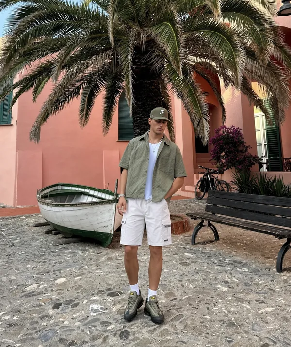 White_Cargo_Shorts_With_Multiple_Pockets_And_Drawstring_Waist