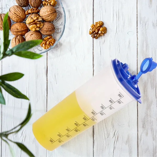 Oil_Dispenser_Bottle_1000ml_Transparent_Plastic_Oil_Pourer_with_Measurement_|_Lock_Nozzle_Lid_|_Leakproof_&_Easy_Refill_Design_Pack_of_2