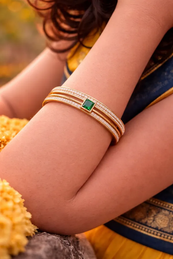 Elegant_Gold-Toned_Bangle_With_Green_Stone_And_Diamond_Accents