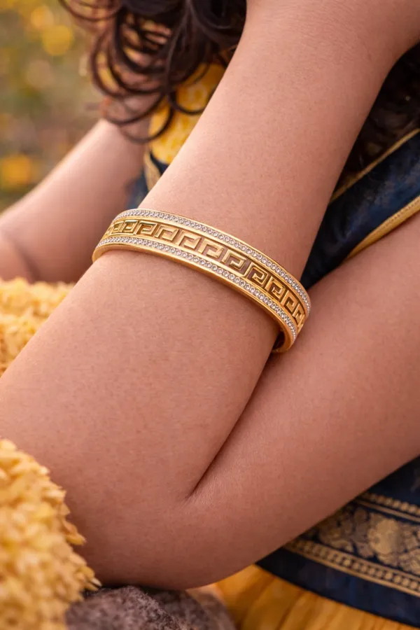 Elegant_Gold-Toned_Greek_Key_Pattern_Bangle_with_Sparkling_Zirconia