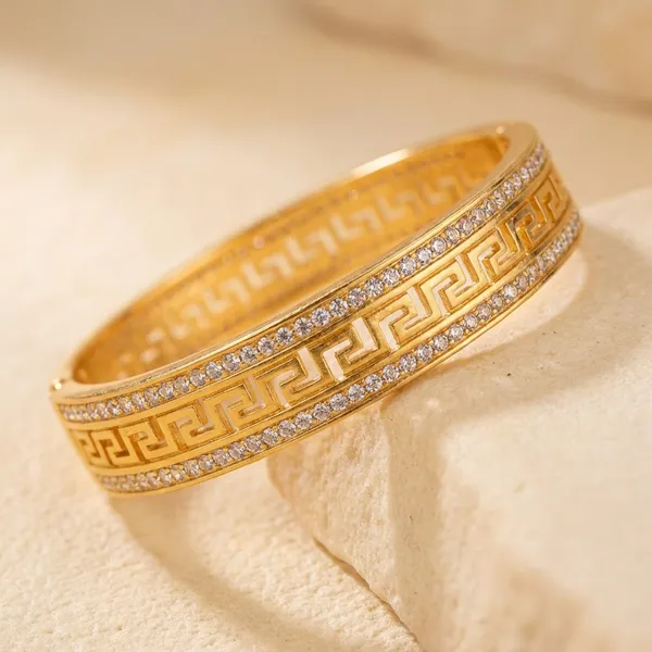 Elegant_Gold-Toned_Greek_Key_Pattern_Bangle_with_Sparkling_Zirconia
