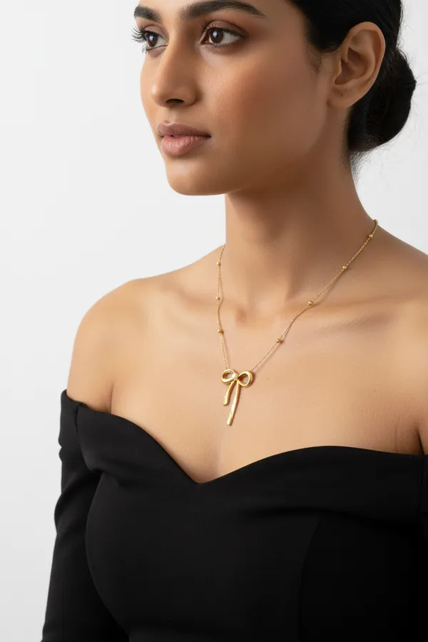 Gold_Pearl_Center_Bow_Pendant