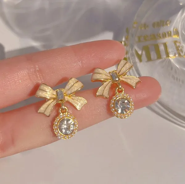 Gold_Toned_Bow_Drop_Earrings_With_Crystal_Accents