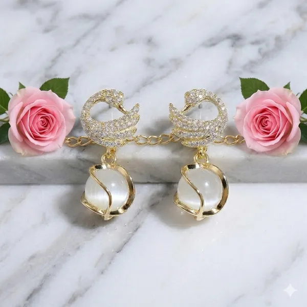 Elegant_Gold_Toned_Swan_Drop_Earrings_With_Pearl_Accent