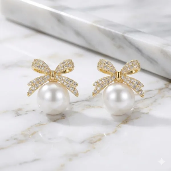 Elegant_Pearl_Drop_Earrings_With_Crystal_Bow_Design