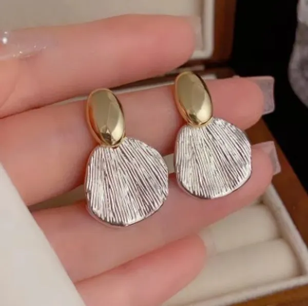 Elegant_Gold_And_Silver_Two_Tone_Shell_Drop_Earrings