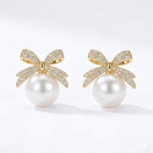 Elegant_Pearl_Drop_Earrings_With_Crystal_Bow_Design