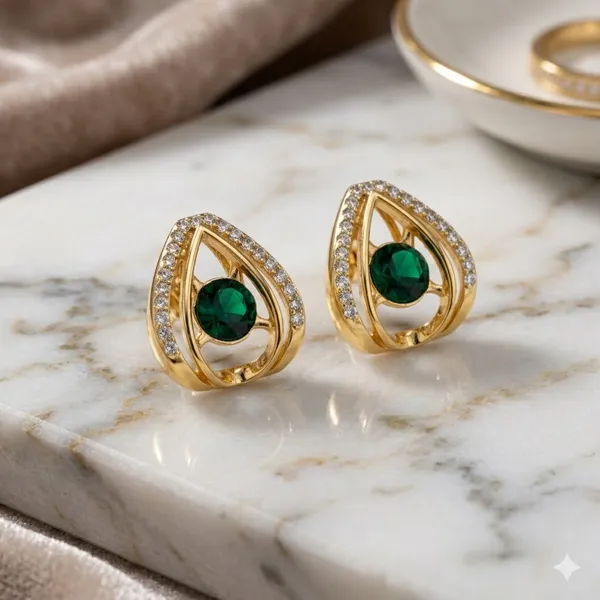 Elegant_Teardrop_Emerald_Stud_Earrings_With_Gold_Finish