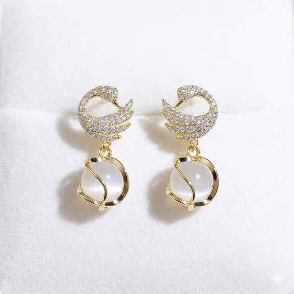 Elegant_Gold_Toned_Swan_Drop_Earrings_With_Pearl_Accent