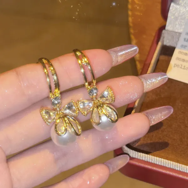 Gold_Plated_Pearl_Drop_Earrings_With_Crystal_Bow_Design