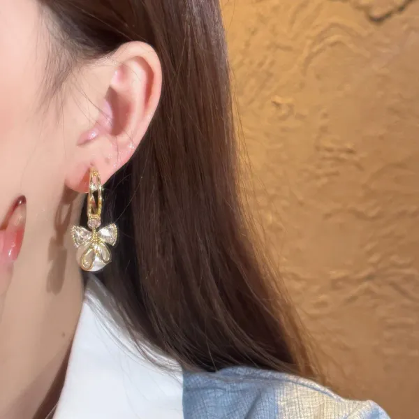 Gold_Plated_Pearl_Drop_Earrings_With_Crystal_Bow_Design