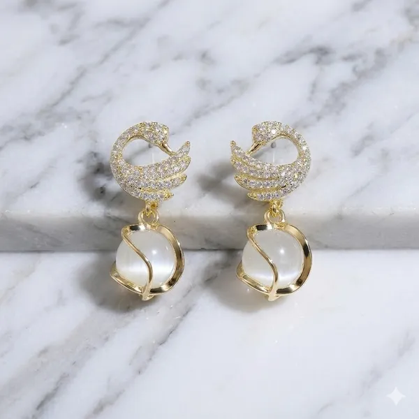 Elegant_Gold_Toned_Swan_Drop_Earrings_With_Pearl_Accent