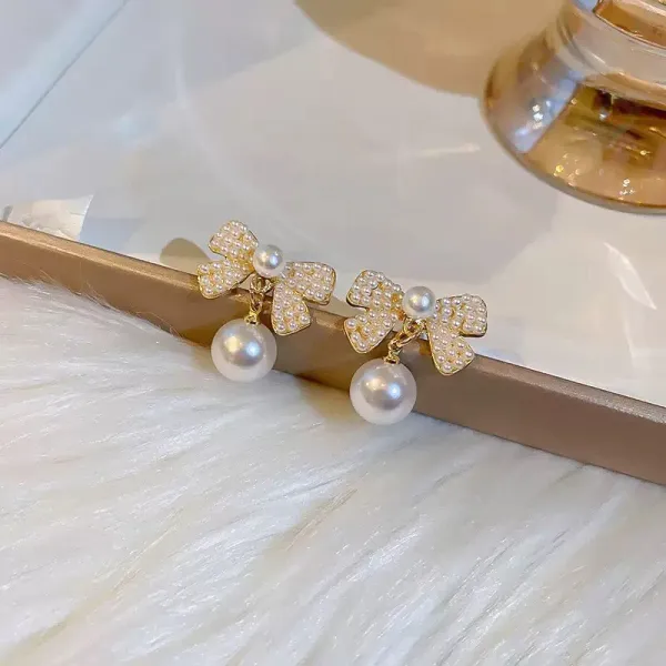 Pearl_Bow_Earrings_With_Dangling_Pearl_Drop