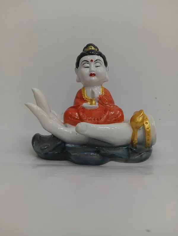 White_Buddha_Figurine_On_Palm