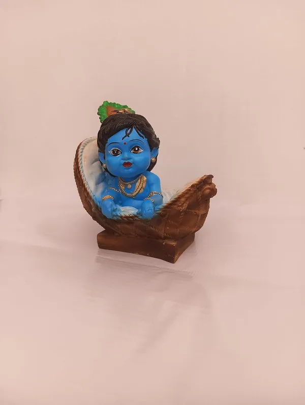 Blue_And_Orange_With_Gold_Accents_Baby_Krishna_Figurine_In_Basket