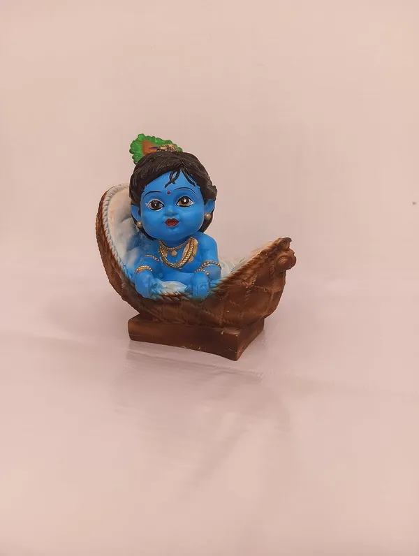 Blue_And_Orange_With_Gold_Accents_Baby_Krishna_Figurine_In_Basket