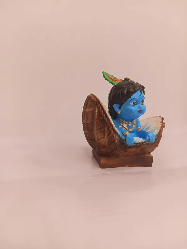 Blue_And_Orange_With_Gold_Accents_Baby_Krishna_Figurine_In_Basket