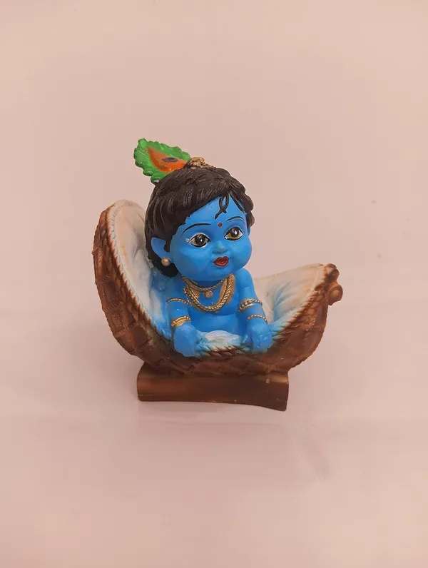 Blue_And_Orange_With_Gold_Accents_Baby_Krishna_Figurine_In_Basket