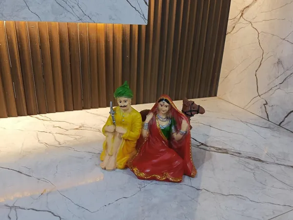 Multicolor_Rajasthani_Couple_With_Camel_Figurine_Showpiece