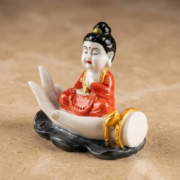 White_Buddha_Figurine_On_Palm