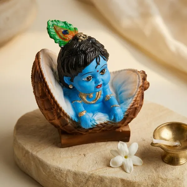 Blue_And_Orange_With_Gold_Accents_Baby_Krishna_Figurine_In_Basket