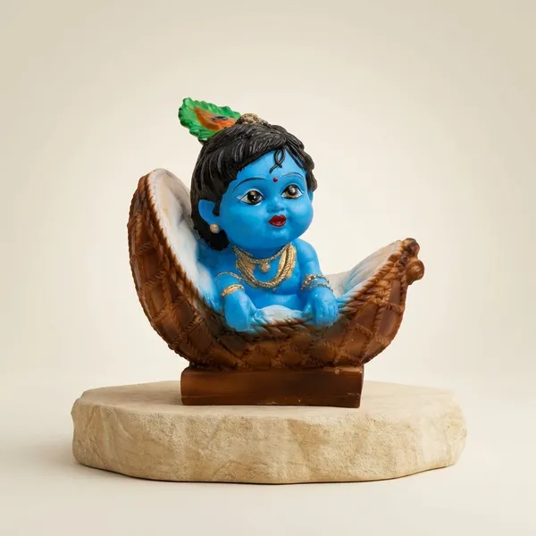 Blue_And_Orange_With_Gold_Accents_Baby_Krishna_Figurine_In_Basket