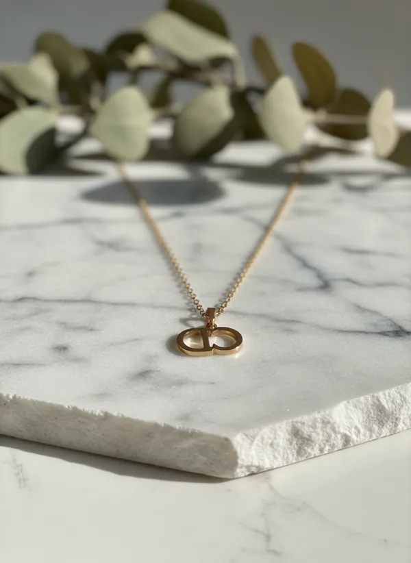Elegant_Gold-Tone_Monogram_Pendant_Chain
