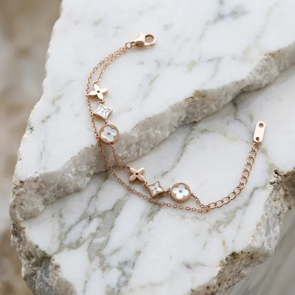 Elegant_Gold-Toned_Multi-Flower_Charm_Bracelet