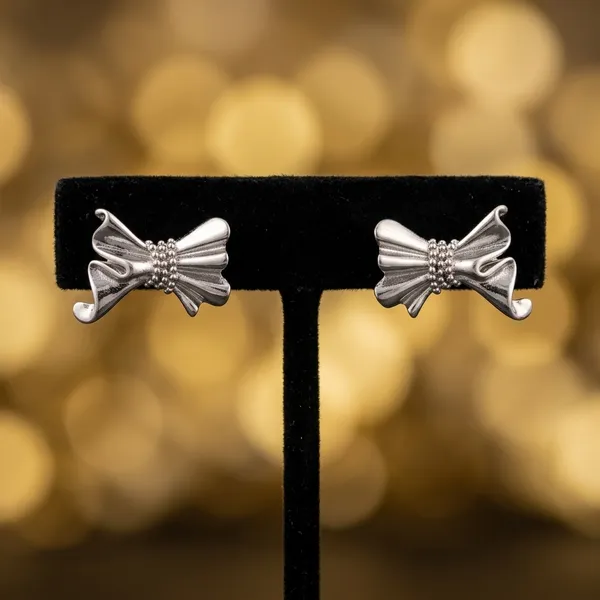 Sculptural_Silver_Bow_Earrings_Hoops