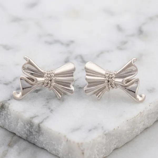 Sculptural_Silver_Bow_Earrings_Hoops