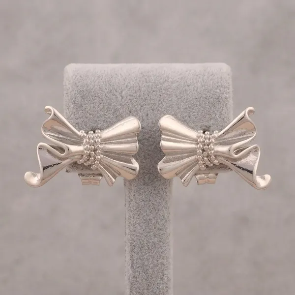 Sculptural_Silver_Bow_Earrings_Hoops